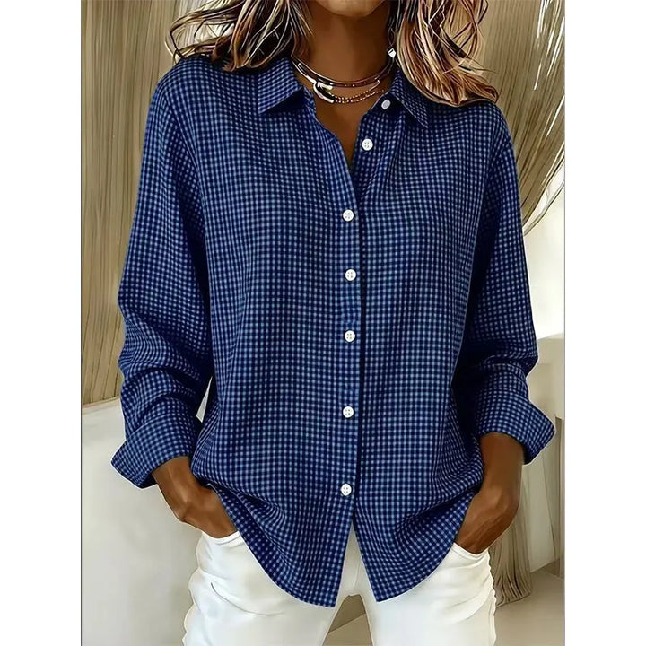 Woman wearing gingham check button-up blouse with long sleeves