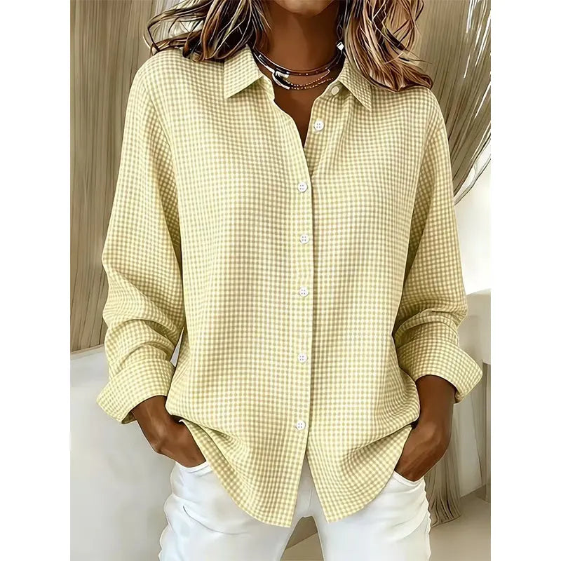 Woman wearing gingham check button-up blouse with long sleeves