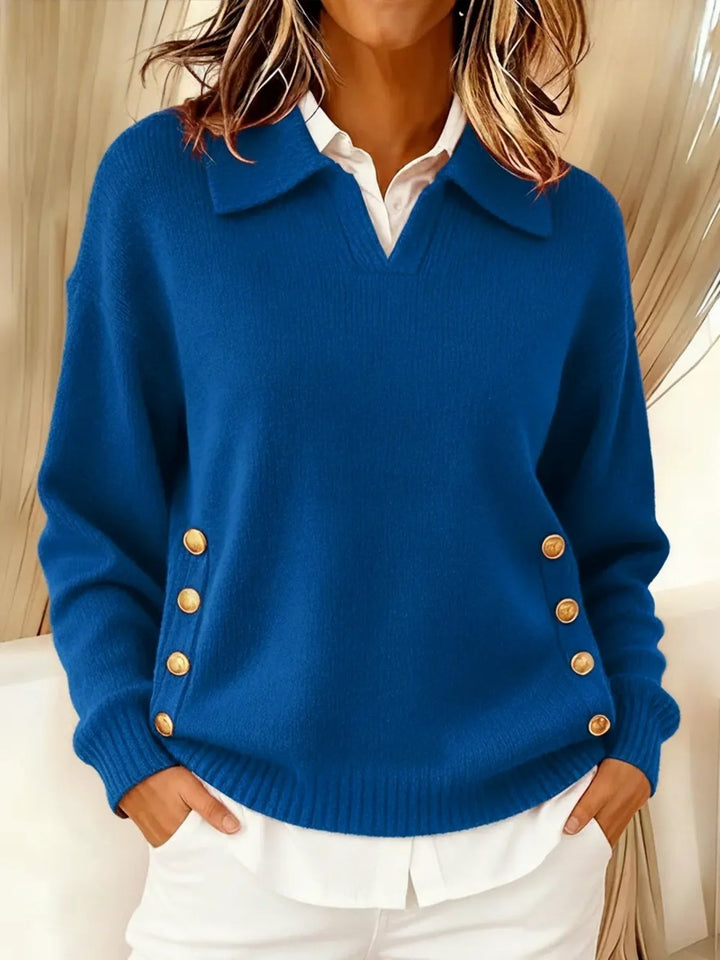 Woman wearing V-neck sweater with collar and gold buttons