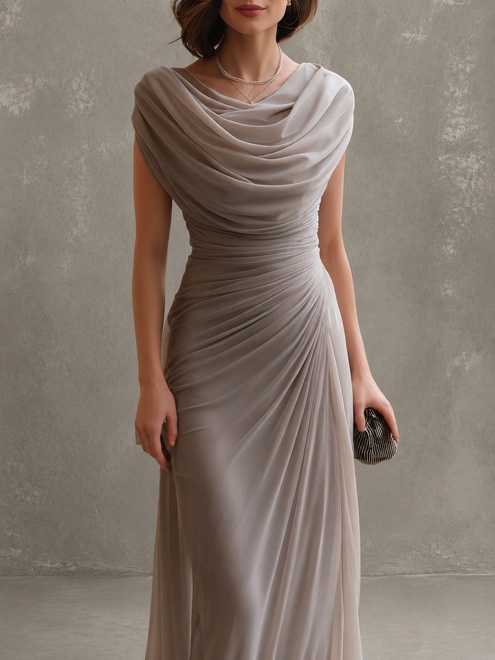 Woman wearing draped sleeveless maxi dress outdoors