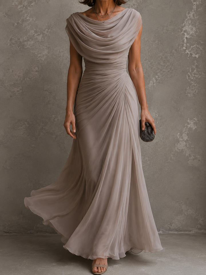 Woman wearing draped sleeveless maxi dress outdoors