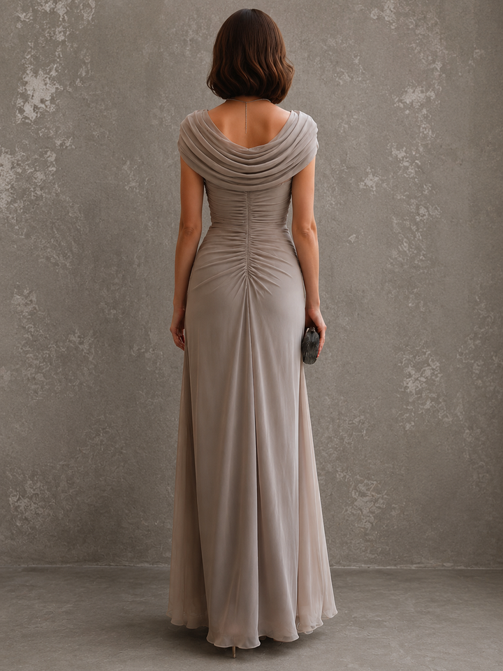 Woman wearing draped sleeveless maxi dress outdoors