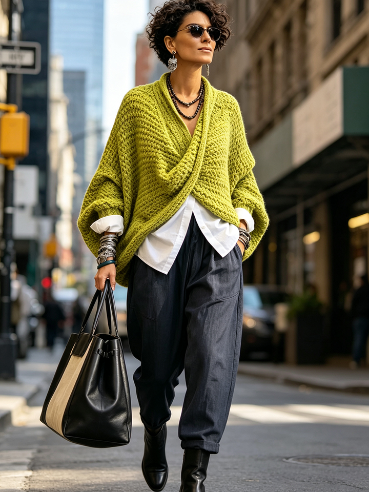Woman wearing crossover V-neck batwing sleeve sweater